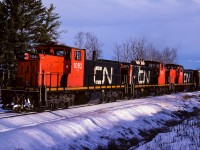 Just enough early morning sun peeking over the trees to light up the sides of the units. The crew has one more quick stop to make in Gibbons and then it is home to Calder yard. I love the first up flat sided CN hopper. Photo was taken a couple miles east of Coronado.