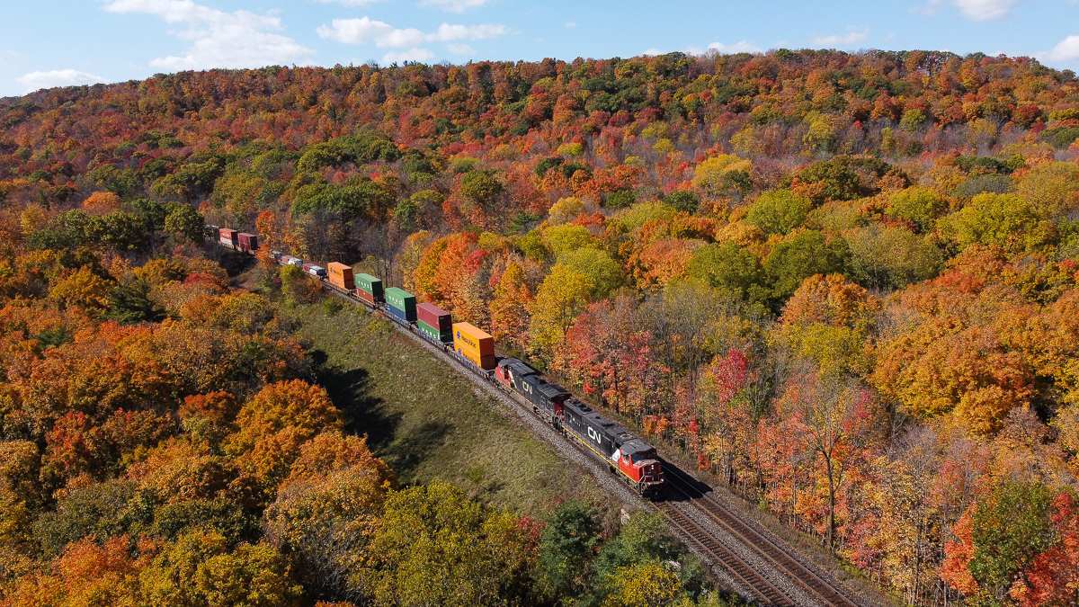 On a lovely October afternoon CN 146 is pictured coming downgrade at Dundas amid the spectacular fall colours.  With the Dundas Peak being made into a pay per visit and reservation spot to go to, the drone came in handy here to capture the colours from a new angle.