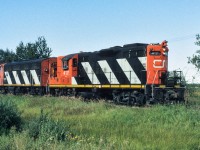An early photo taken with my Canon TX on the west edge of Redwater. This is one of the few instances of my photographing a CN 4100. The vast majority of the units that came through town were the light branchline 42 and 4300 series loco's. As the 4111 will be renumbered to the 4370 in 1984, this helps confirm the date is 1983. Also, from the CNRHA, the 4370 will go for rebuilding into slug 233 in 1987.