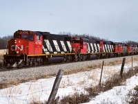 A train of approx. 30 sulphur empties is approaching the connecting track at Kerensky. The consist is made up of deadhead units. Only the 4782, 4733 and 4702 were throttled up. The 4806, 4807 and 4803 were just idling as they went by. To match the extra units, an extra caboose 79624 was with the 79675 on the tailend. Both trains will return in about 24 hours time, each bringing 50 loads home. Of note, the 4733 was a rare visitor on the Coronado Sub.