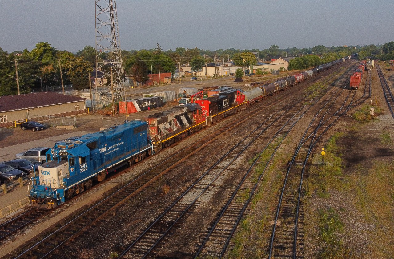 CN L580 holds the South Main at Brantford with GMTX 2323 CN 4726 CN 2675 and 109 cars bound for Garnet Yard and then Nanticoke.With the Aboriginal Blockade lifted from the tracks after 2 weeks of closure, CN wass running trains through to Garnet in Daylight only to ensure safety of all, this move only lasted a few days.