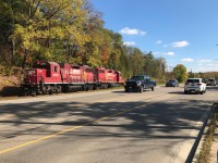 Canadian Pacific’s Hagey Job with GP38-2’s 3108 and 3118 are returning back to Cambridge at a leisurely pace as they parallel old King Street in Kitchener, Ontario. The pair had set-off cars for CN at the interchange at South Junction in Kitchener before departing light power to Hagey yard. October 19, 2019.

