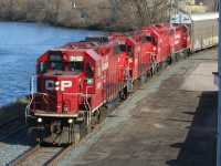 CP T72 slowly runs beside the Speed River in the community of Preston, Ontario in Cambridge on the Waterloo Subdivision. The train is fairly sizeable and will soon fill the nearby yard at Hagey. It is powered by CP 3130, 3013, 3022 and 3045. 