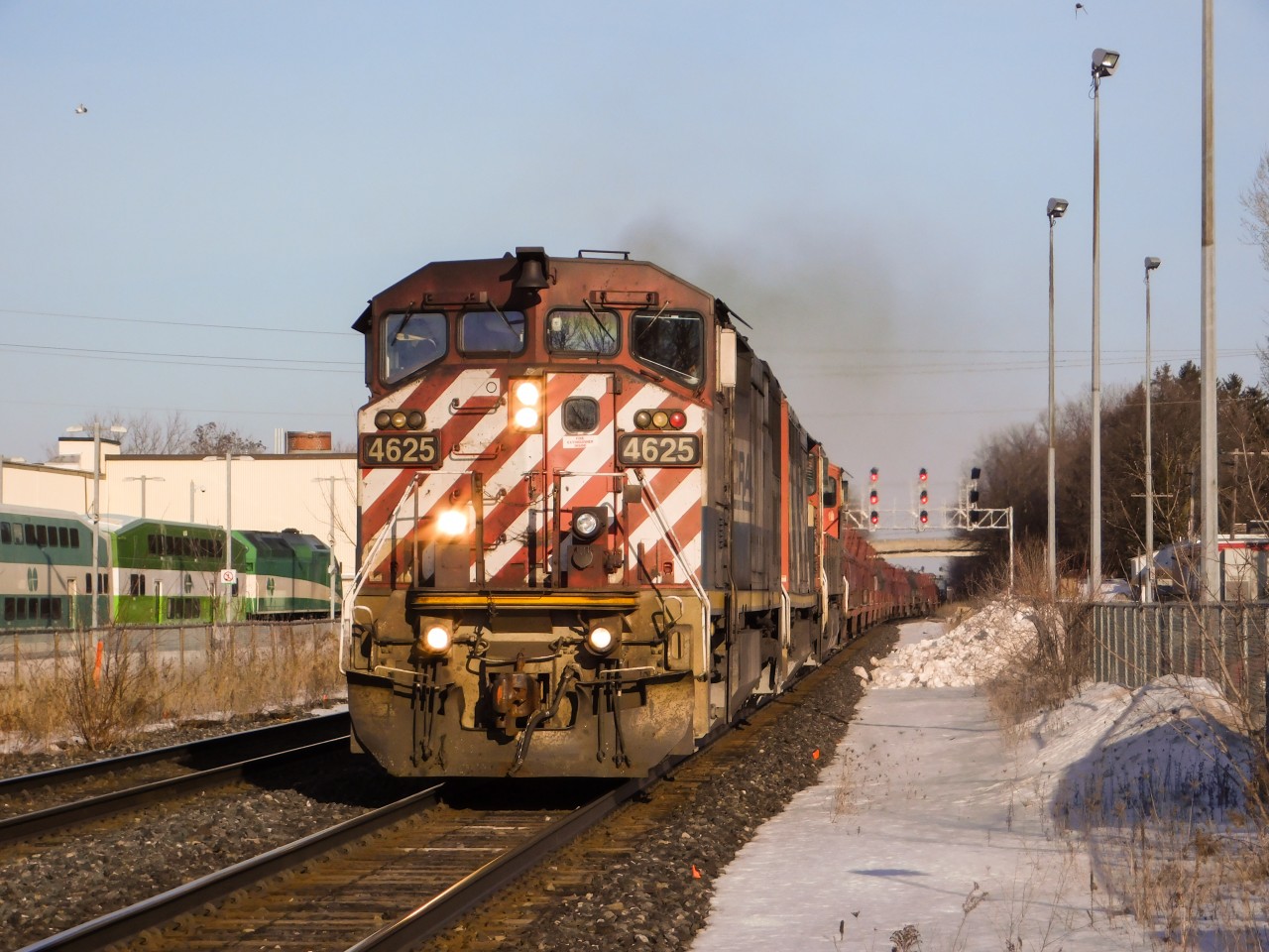 At the time of posting this, the infamous season of Winter is just around the corner, scenes like this will be possible again! On a bright and sunny February day, CN Macmillan Yard - Aldershot Yard turn L570 charges through Georgetown with a pleasant BC Rail (or, BCOL) GE C40-8M in the lead, this unit was built for the British Columbia Railway in 1993 out of General Electric's Erie, PA locomotive plant. One could wish for the unit to have a cleaner nose, but you take what ya get! This unit is still active on CN's roster.