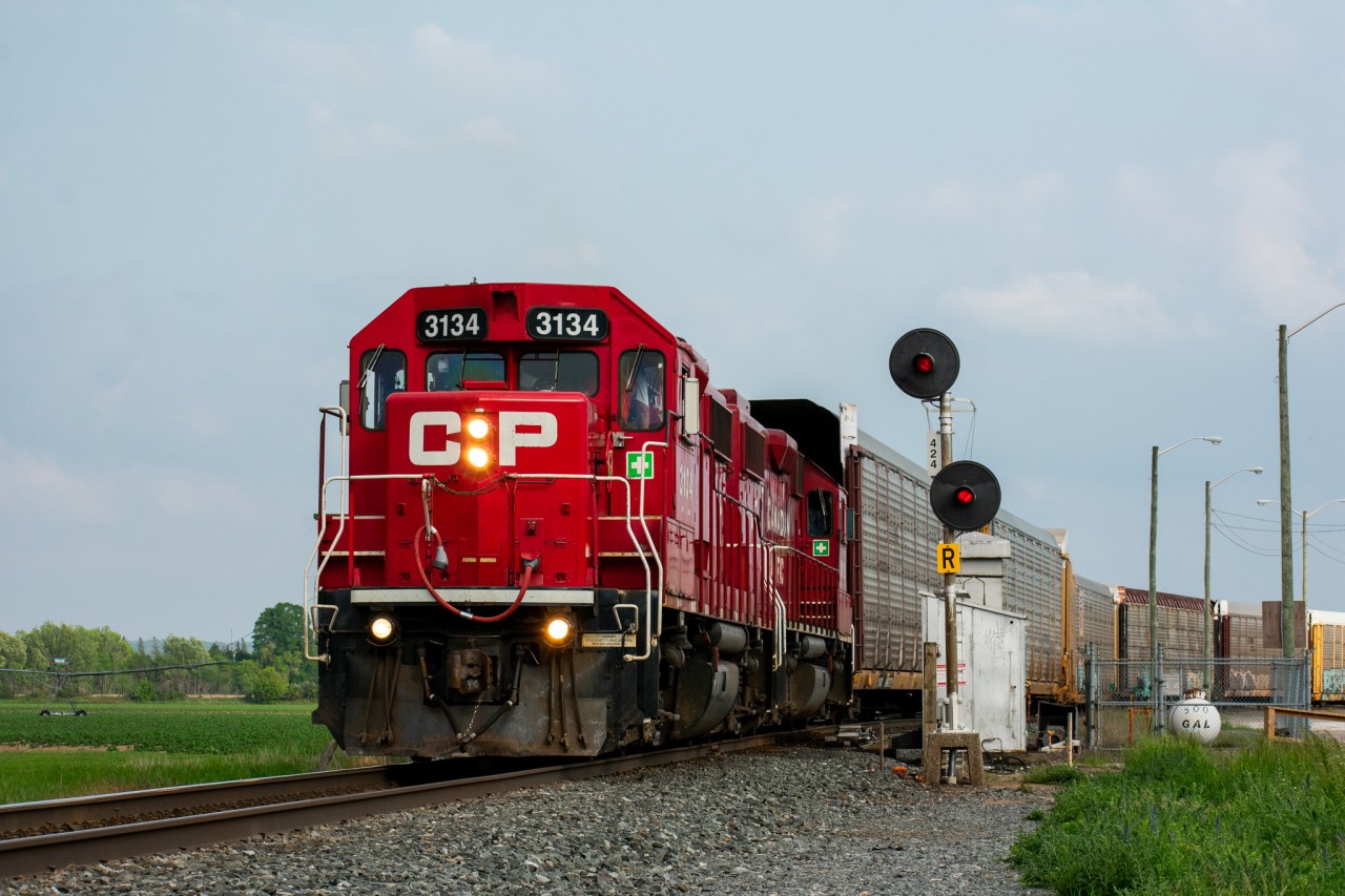 Honda Racks

On a nice June evening, CP T23 heads north out of Spence Yard with some empty open autoracks destined for the Honda facility in Alliston, just a mile or so up the line. Spence is always a nice spot to hang out at, as not only do you get mainline action but you usually can catch some yard movements in between the through trains, not to mention trains 420 and 421 both regularly work the yard here which can provide for some nice photo opportunities too. You can never go wrong with some classic searchlights either!