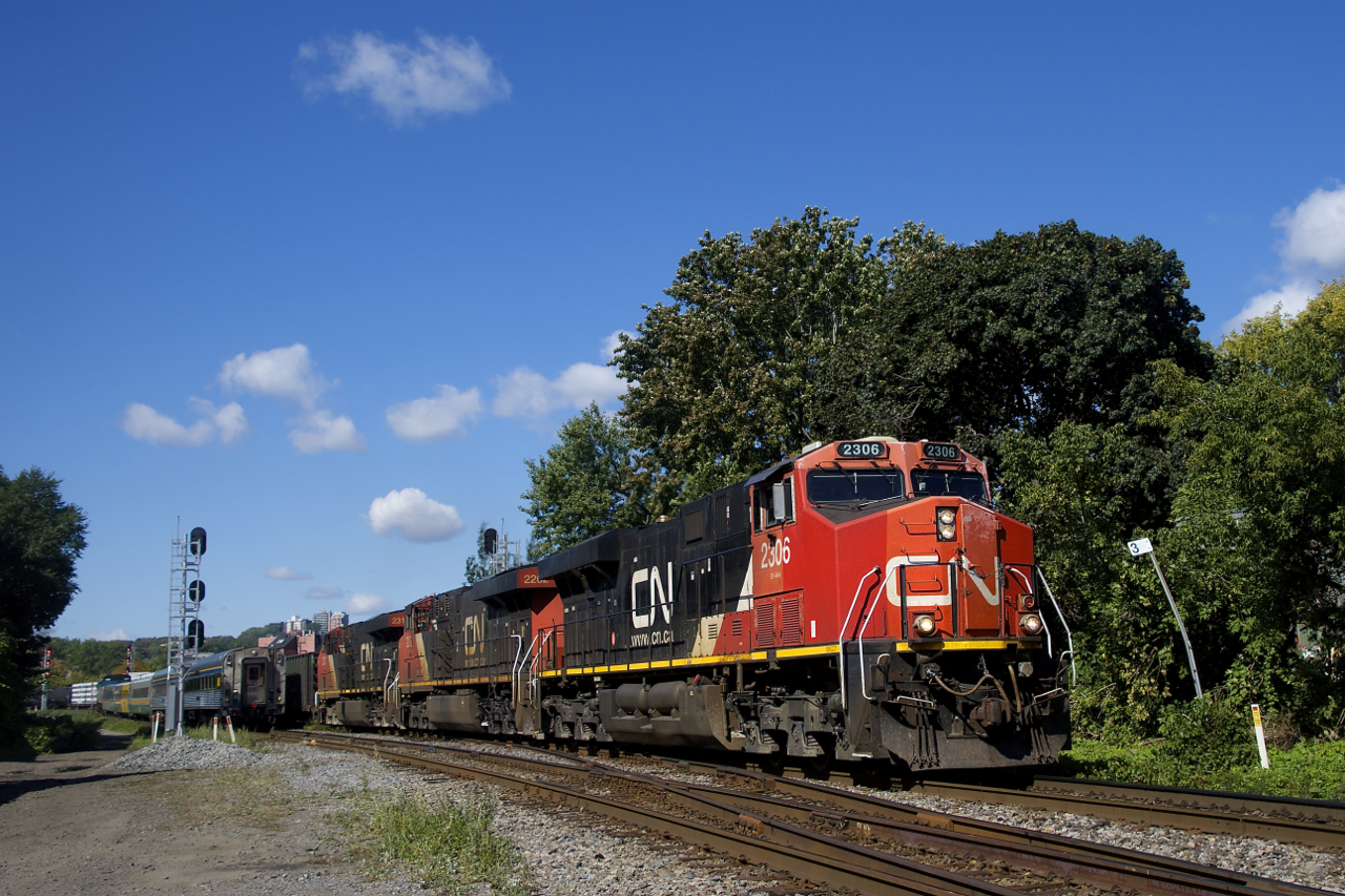 CN 324 has a trio of ES44DC's (CN 2306, CN 2262 & CN 2312) as it heads east with 94 cars for the NECR. At left VIA 35 is stopped and will only get its signal once CN 324 clears.