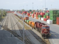 CP 143 with ES44AC's CP 8719 & CP 9360 lifts in Lachine IMS Yard.