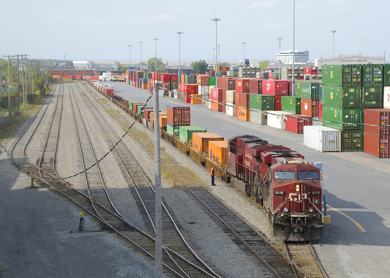 CP 143 with ES44AC's CP 8719 & CP 9360 lifts in Lachine IMS Yard.