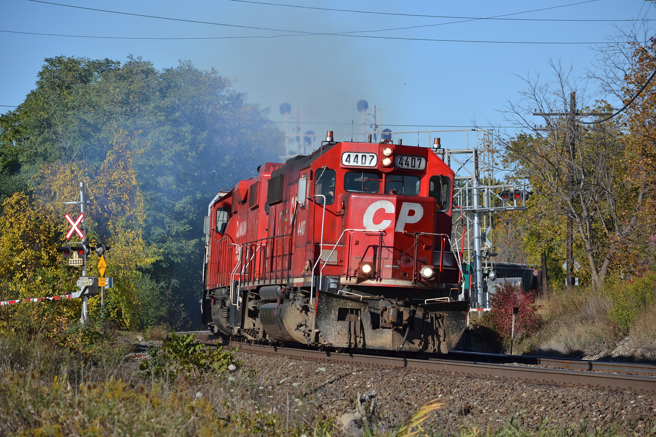 CP 4407 leads the charge East with hoppers in tow for Canpa. Today was a nice change of pace from the rather dreary weather in Southern Ontario, overall, probably the best shot so far of the month, especially scratching off another oddball unit.
