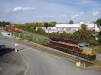 CP 142 with heritage unit CP 7018 leading is making a small set-off in Lachine IMS Yard.