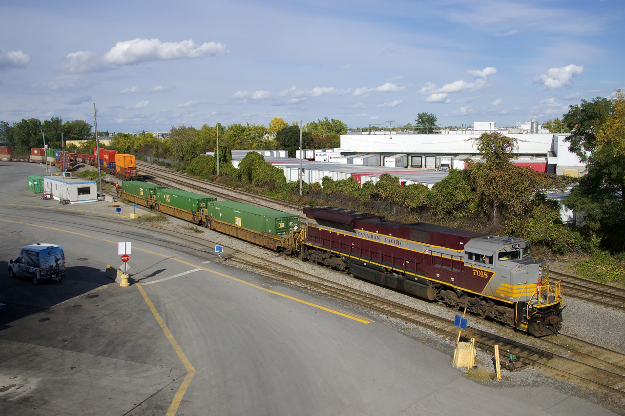 CP 142 with heritage unit CP 7018 leading is making a small set-off in Lachine IMS Yard.