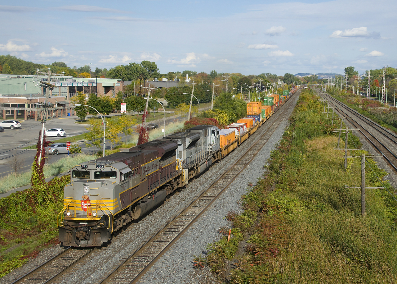 CP 143 has CP 7013 (in the script heritage scheme) and CP 7023 (the Air Force unit) as it heads west through Pointe-Claire.