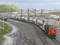 Windmill train CN X319 is stopped at Turcot Ouest as it gets recrewed. It has CN 3280 & CN 2613 for power