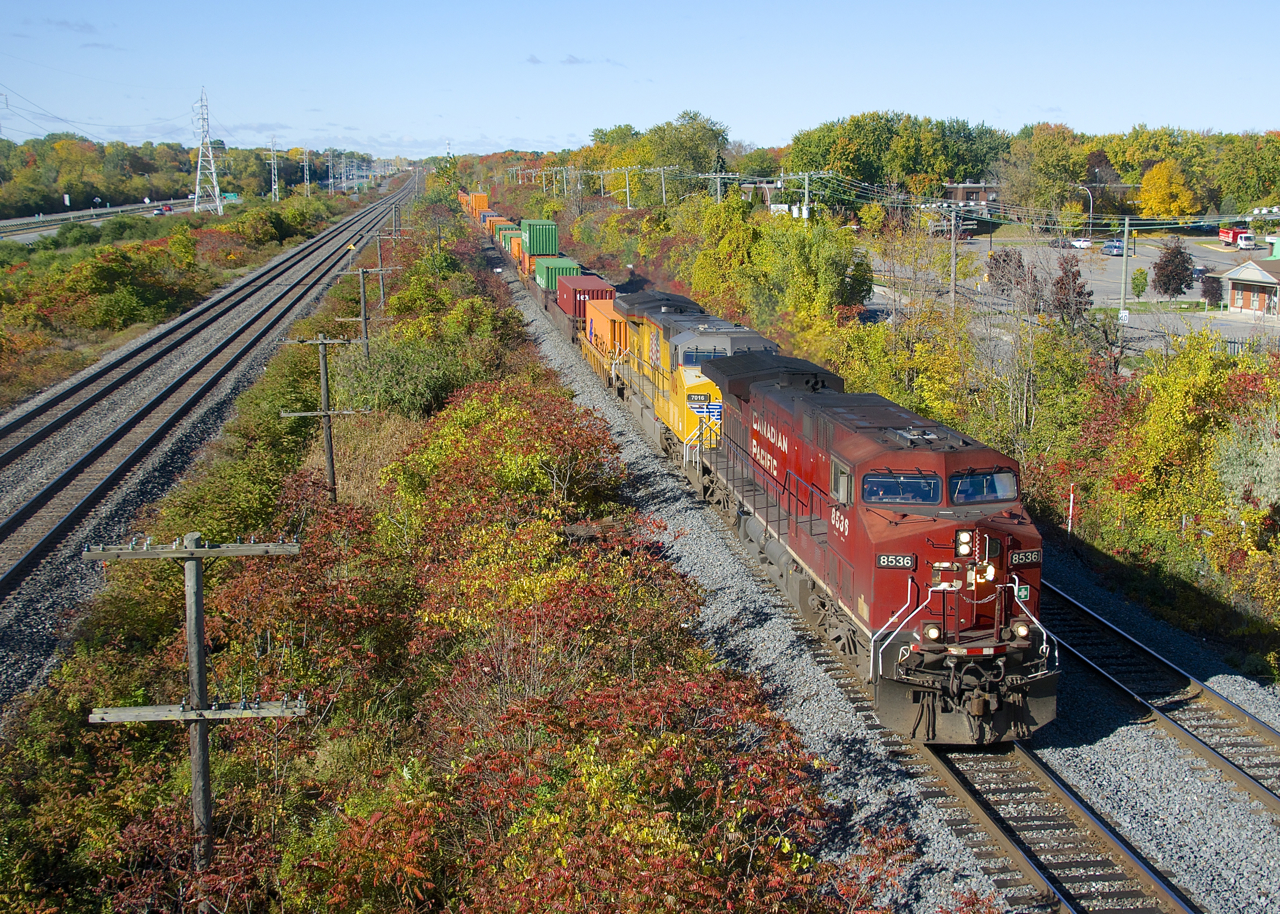 A very long CP 118 (738 axles) is through Beaconsfield with CP 8536 and UP 7016 up front and CP 8020 mid-train.