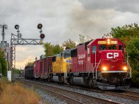 <b>A Special T15</b><br><br><br><br><p>CP T15-01 heads east under the infamous Bartlett intermediate signals with an attractive pair of classic EMD units and just over 6,000 feet on the drawbar. Just before the units hit me the engineer throttled the beautiful EMD 710s to around notch 6-7 as their tail had just finished clearing Lambton and it was a highball to Agincourt from there on out. Man, what a beautiful sound!</p> <br><br><p>Previously in the day (around 0700 to be exact) word got out that SD60 #6255 & UP SD70M #4033 were light power on a 244 headed for Toronto Yard after their entire train was dumped in Wolverton. After hearing this, I rode about as fast as I could on my bike to get it at Leaside. After arriving, I received a call from one of my good friends who went to Osler in attempt to catch it as well. He said that RTC had informed 244 the power was to be terminated in Lambton Yard instead of Agincourt and that a cab would be called for the crew, even West Tower (who are in control of all Lambton Yard movements) had no clue why RTC wanted to do this. At the time, hearing that made me pretty upset but I did not let that ruin the rest of the day. I decided to bike over to the west end and enjoy a nice relaxing railfanning day with my friend. A nice day it was, we caught a decent amount of trains as well as getting some nice souvenirs from a track foreman! Through all of this though, the biggest question of the day still stood; why did CP want these 2 units in Lambton?</p> <br><br><p>Both my friend and I pretty much gave up on it after 421 had passed and both headed our separate ways. I started the trek back east and was slowly making my way along King Street at just after 5PM when I got the word that CP 6255 was being fired up in Lambton and brake tests were under way. Naturally, I biked as fast as my legs could carry me back up to the North Toronto (I was not inclined on missing this power if it was truly to be heading east). I got up to Bartlett with plenty of time to spare and set up, and after the scanner being quiet until just around 6, I started to question whether or not they would actually come.</p><br><br><p>It was getting to the point where I got extremely excited to hear the signature CP RTC call-in on the scanner only to find out it was either a Milton GO train or a track foreman... but finally, the wait payed off. "RTC T15 callin' over?" "T15, CP 6255 East, ready to depart Lambton for Agincourt with 6XXXft". In one small RTC call, the looming question from early in the morning was finally answered, and it was confirmed they'd be making a break eastward, and with no time to spare either, as the rain was just beginning to roll in and the sun was about to call it quits for the night. This was without a doubt one of my best and most satisfying catches of recently, and I hope you enjoyed that little story to go along with it! Hey, sometimes being a railfan on the North Toronto pays off!! :)</p>