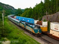 A meet goes down between the westbound <i>Canadian</i> and an eastbound Canadian National IMS at the one time crew change point of Redditt, Ontario. 2018 was quite a dry year and by this time in June the sun had been obscured by area forest fires in this part of northern Ontario, Manitoba and Saskatchewan. 