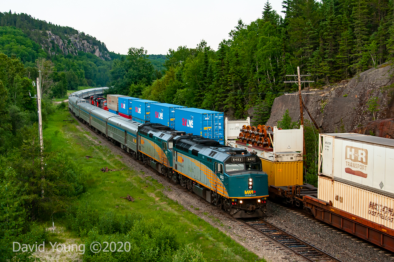 A meet goes down between the westbound Canadian and an eastbound Canadian National IMS at the one time crew change point of Redditt, Ontario. 2018 was quite a dry year and by this time in June the sun had been obscured by area forest fires in this part of northern Ontario, Manitoba and Saskatchewan.