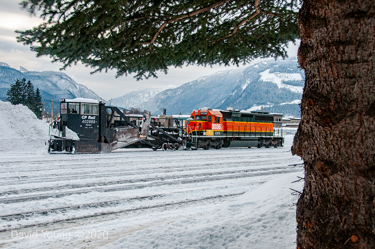 The yard in Revelstoke is getting a much needed cleaning. Assisting in the spreading operation with Jordan Spreader CP 402889 are a pair of visitors in the form of CITX 3036 (and CITX 3008 out of frame). A pair of SD40-2's with obvious Burlington Northern heritage. The amount of snow that falls over the winter season in Revelstoke and area mountain passes is incredible with plow and spreader operations frequently being called to clear the rails of the Mountain and Shuswap Subs.  
Roster Note: CITX 3036 would be purchased by Norfolk Southern a couple years later and become NS 3501, being painted up in an Operation Lifesaver scheme. It was removed off their roster by 2020- disposition unknown to me.