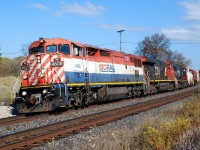 Get 'em while you can.  With their ranks thinning, it was nice to catch a decent looking BC Rail C40-8CMu in perfect light leading CN 435 today.  435 leans around the curve at milepost 19 as the conductor was reviewing his paperwork, getting ready for their work at Brantford Yard.  Their timing was perfect; I left work at noon, photographed the train out by Garden Avenue and got back right at 1 p.m. Not that it mattered because no one was around since most staff in the department regularly "work" from home.