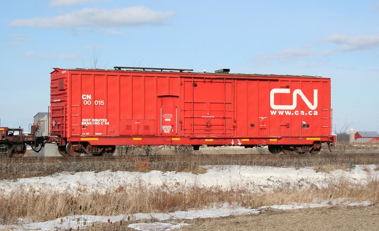 A CN distributed braking car brings up the tail end of a detouring intermodal train through Sarnia.