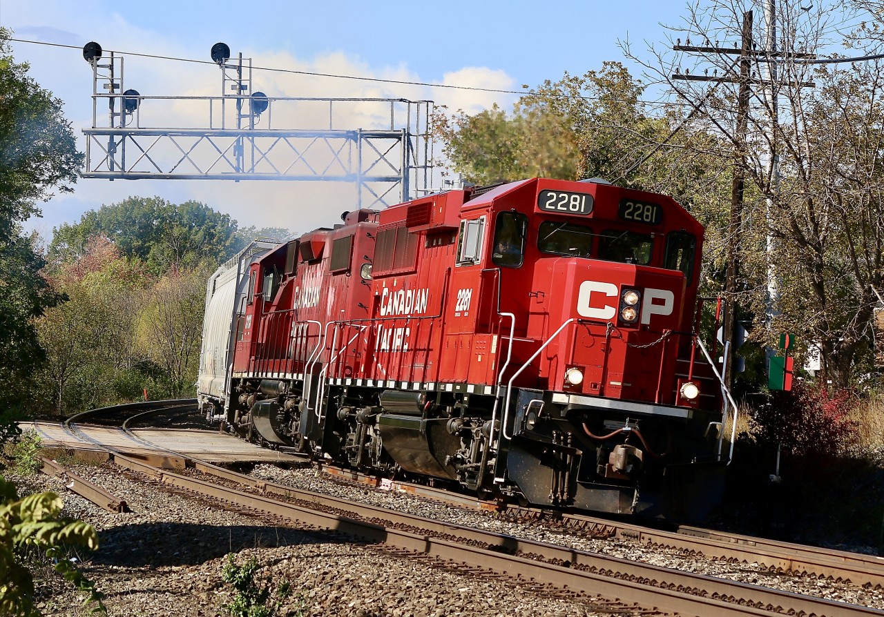 It truly amazes me how much things change over the years. I first started railfanning Streetsville back in the mid 1990's, back then the village was served by CP from Guelph jct. Typically Monday-Friday a line C424 or RS18U would be the power, when the Alco's were retired leased GP40'S replaced them. By then the OSR took over CP's contract to serve Guelph and both local assignments no longer call Guelph Junction home. The Streetsville turn then started at West Toronto. As the years passed the brief use of leased GP40's ended and rebuilt GP9U'S replaced them. The economic termoil of the late 2000's forced the temporary closure of West Toronto yard and the Streetsville turn moved to Agincourt yard. Eventually West Toronto yard reopened and T14, the streetsville turn returned to the yard. Not long after the GP9U'S were retired and GP38'S and new GP20ECO's replaced them. As for Streetsville, rail service over the years has gone from daily to Monday-Wednesday-Friday device, and while a few new customers have surfaced over the years, almost double have left. Nevertheless T14 is still one of my favorite locals. Here T14 has finished it's work under mostly rainy skies, which have finally cleared for the trains departure. On the way home the train will meet both trains 651 and 246. This power set has been around most of the summer so I'm hoping the white smoke from the trailing unit might mean some shop time ahead, and finally a new power set.