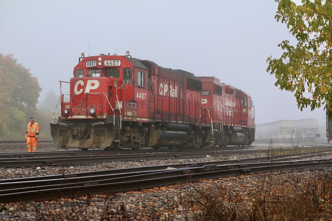 The sun is doing its best to burn off the thick layer of morning fog as CP local T14 pulls out from behind a cut of cars and heads for another track. One of the crew walks along side to throw the next switch. Within the next hour all the fog would be gone along with T14 as he headed back to Toronto. CP 4407 has to be one of the dirtiest GP38's on the roster, but that just goes to proves what kind of a workhorse the GP38 model is. It's nice to see a number of the former SOO Line GP38'S north of the border.