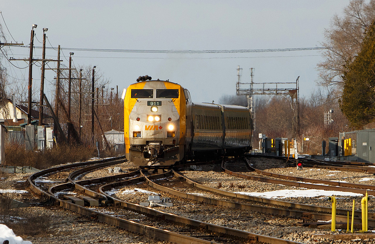 In the low light of a December afternoon, VIA 911 leads #47 through the crossovers on the CP Belleville Subdivision in Smiths Falls. The train has come off the VIA Smiths Falls subdivision, once a segment of the Canadian Northern mainline. Shortly it will pass the former CP/VIA station and diverge onto the Brockville Subdivision.