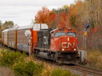 The engineer waves from 275 as they pass Mile 30 with a solo SD75i