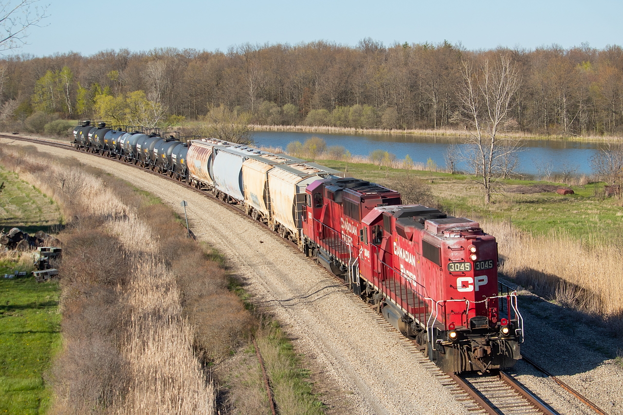 After working Chemtrade and Washington Mills in Niagara Falls, CP TE11 is about pass under Netherby Road and will soon re-enter the Hamilton Sub from the Montrose Spur, the view of which you can see here.