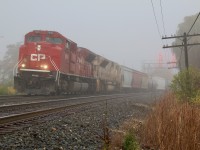 There is something about the fog that always brings me trackside. As luck would have it after my morning school run I noticed that CP 234 was bearing down on Streetsville. While I was hoping the signals would put on more of a laser show, I wasn't disappointed with the consist as SD70ACU class unit #7000 leaned into the curve just east of Ontario Street with "Desert Storm" painted #7021.