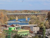 An interesting double headed VIA 72 with an interesting painted BUDD car trailing, blast its horn for trespassers at the end of the Grand River bridge at Paris. By this date most of the fall colours that remain on the trees look more burnt than vibrant, but nevertheless any image taken from the look out here looks impressive. 