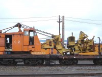 Ready and waiting for the first big snowfall of winter 2007/2008 is QCM C2 113-002 3531, a Wellman model DE 600 locomotive crane, serial number 4385, built in 1959. Instead of the traditional lattice type boom used for hoisting, magnet, and clam bucket work, the unit is outfitted with a Rolba Snowblast snow blower attachment QCM 161-025 3540. I captured the combined machines sitting at the QCM shops in Port Cartier, QC during an October 30, 2007 visit to the railways office and shop complex.