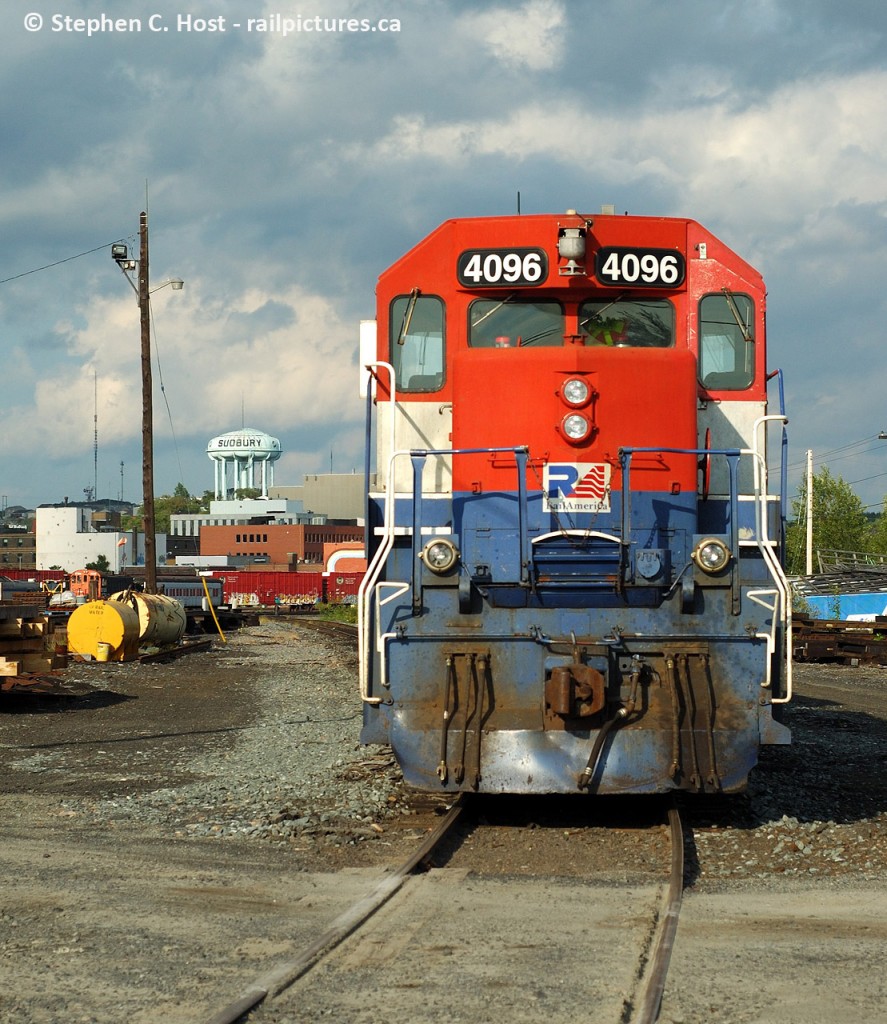 I would imagine this was train 431 having arrived in Sudbury and parked, finishing their day in the yard. I happened upon it and followed them to a parking spot while the sun danced in and out.. iconic sudbury water towers in the distance. Three RLK units on this train.