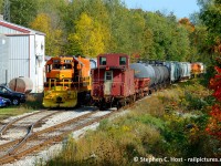 Branchline railroading at its finest with a meet of two trains on the Guelph Junction Railway. Bringing up the rear of 582 is OSR 4900 (which has been graciously donated to the <a href=http://www.ghra.ca/files/ghra_application.pdf target=_blank>Guelph Historical Railway Association</a> by OSR) and yet you can still see the head end of 582 in the frame. The crew of 583 will blast off for Guelph shortly after this photo was taken and I would give pursuit. <br><br>If folks are interested, I'd like to humbly offer a plug  for the GHRA by saying with 4900 in our fold we have an immediate project to work on, and you'd be more than welcome to join us or support our group with a membership if you wanted to get involved. 4900 is a rare live rail example of a Riveted Steel Angus rebuilt caboose and we believe it is very rare to be in this condition as very few were rebuilt before they moved to the more modern style that dominated the 70's and 80's (Anyone know how many were made? TSG says 14..) We aim to maintain/improve it to full operating condition. 4900 will need some stabilization (windows) once we get it moved to Guelph in 2020 and we'll form a team of folks to work on restoration in 2021. Able bodied folks and/or supporters from a distance all welcomed with your donations 100% tax deductible with a tax receipt. Cheers and thanks to OSR  for their most gracious donation.