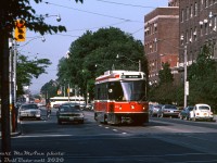 Still early in the new CLRV era, Robert McMann wasted no time in capturing the newest streetcars in various street scenes around the city. Here, TTC CLRV 4044 heads eastbound in traffic on College approaching Elizabeth Street, running on the 506 Carlton route. In the background, one can see a Gray Coach Lines MCI MC-8 heading southbound on Queen's Park Crescent crossing to University Avenue. On the right are the University of Toronto Best and Banting buildings (built 1954 & 1930), named after the two UofT researchers who, in the 1920's, first discovered insulin.
<br><br>
<i>Robert D. McMann photo, Dan Dell'Unto collection.</i>