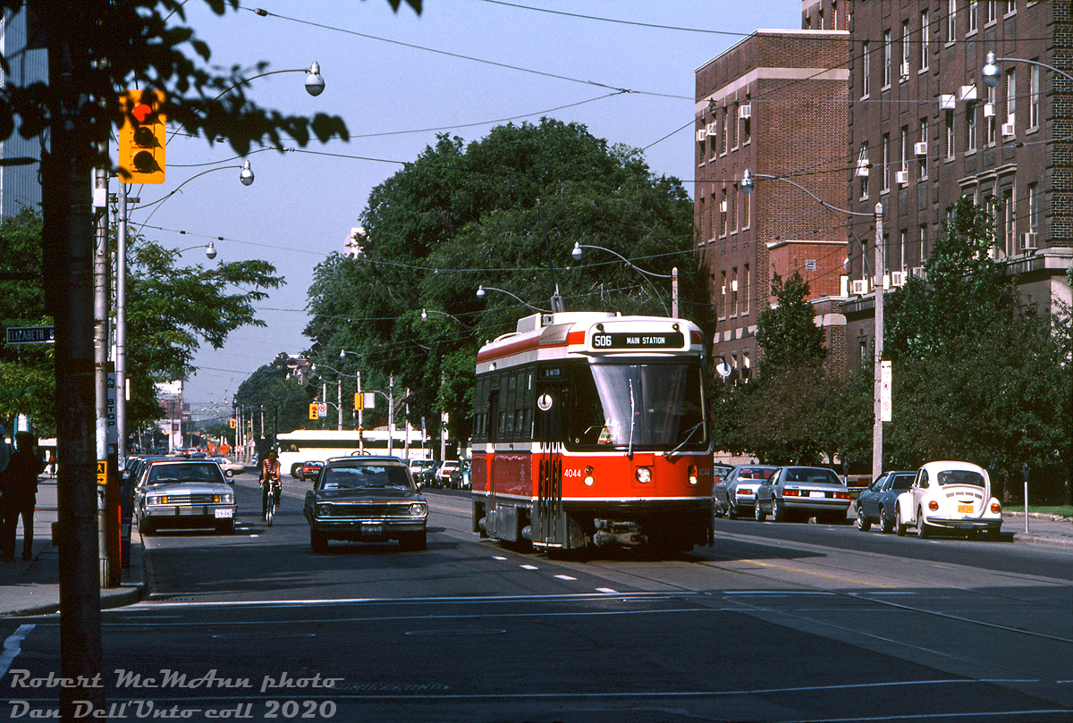 Still early in the new CLRV era, Robert McMann wasted no time in capturing the newest streetcars in various street scenes around the city. Here, TTC CLRV 4044 heads eastbound in traffic on College approaching Elizabeth Street, running on the 506 Carlton route. In the background, one can see a Gray Coach Lines MCI MC-8 heading southbound on Queen's Park Crescent crossing to University Avenue. On the right are the University of Toronto Best and Banting buildings (built 1954 & 1930), named after the two UofT researchers who, in the 1920's, first discovered insulin.

Robert D. McMann photo, Dan Dell'Unto collection.