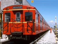 Despite their age, the 1950's-built Gloucester "Red Rocket" subway cars still looked great years later. An 8-car train of TTC "G" cars, lead by G1 5082, sits parked inside the new <a href=http://www.railpictures.ca/?attachment_id=37314><b>Wilson Subway Yard</b></a> next to the maintenance shop buildings. Note the Identra Coil mounted on the upper right of the lead car (used to activate "next train" destination boxes on station platforms) as well as the left-side mounted operators controls - all later car models including the M1's, H1's and so on would come with operators controls mounted on the right side. Another interesting note is the Gloucester cars were only 57' long, allowing a maximum train length of 8 cars at a station platform (as opposed to later 75' long cars that would max out at 6 cars). The last of the G's were retired in the early 90's, with cars 5098-5099 preserved at the Halton County Radial Railway museum. <br><br> This scene was photographed during a tour of the shops as part of a weekend fantrip during July 1st-2nd 1978. A new pair of <a href=http://www.railpictures.ca/?attachment_id=30886><b>Hawker Siddeley H5</b></a> cars are visible parked in the distance, part of an order purchased for the new Spadina line extension that opened earlier that year. <br><br> <i>Photographer unknown, Dan Dell'Unto collection slide.</i>