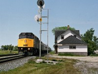 The eastbound "Canadian" hiballs past the unused Whitemouth station east of Winnipeg. CP had left hand running on it's double track between Winnipeg and Thunder Bay. This was due to 2nd track constructed around 1912 to the north of existing line and had grade separated segments to ease grades for primarily loaded eastbound tonnage 