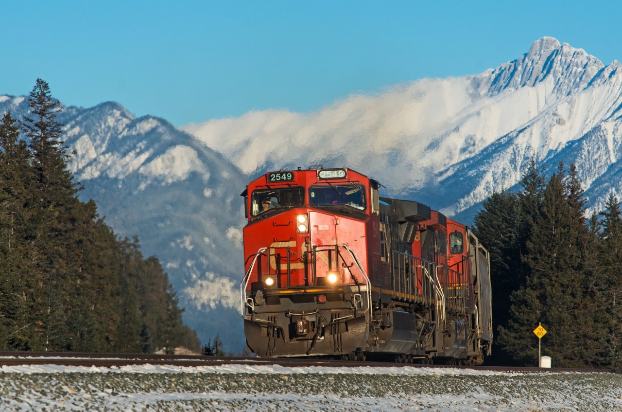Westbound grain loads make their way through the park towards Jasper proper for a crew change.