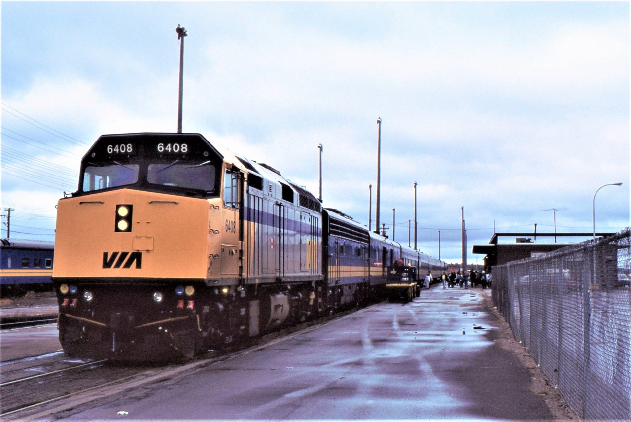 OVERNIGHT ON THE OCEAN - Arriving at its terminus station, VIA Rail train # 14, the Ocean, is captured by the photographer under the grey skies of October 3, 1988. He and his fiancée had boarded the previous evening in Montreal and had just enjoyed a delicious breakfast courtesy of the dining car staff upon learn of their engagement in the Rockies on # 1.This would be the third last train of their nearly month long transcontinental rail journey. The # 12 Atlantic would arrive shortly and they would board for Truro where they would transfer to the 604 RDC to North Sydney and before nightfall, be on the MV Caribou for their native Newfoundland.