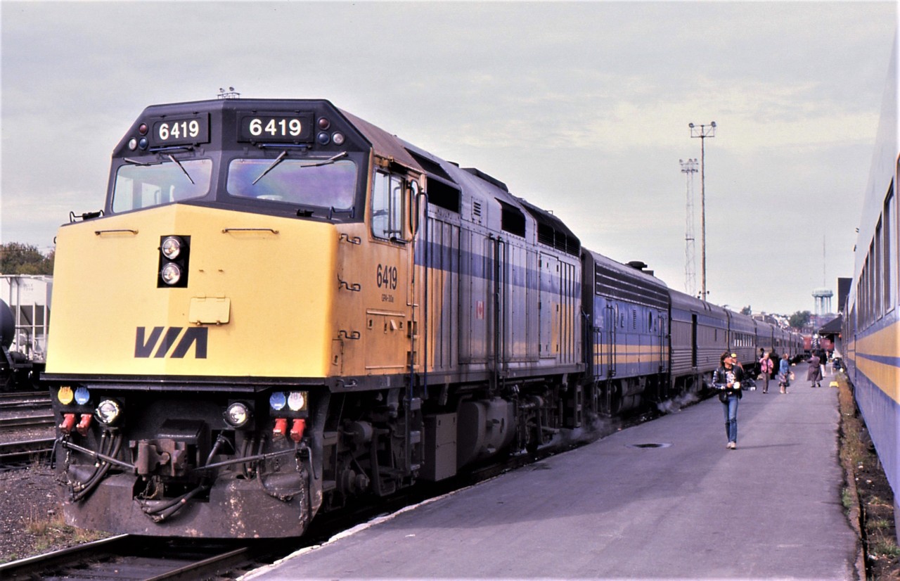 CANADIAN CUT OFF - F40PH 6419 now leads the newly marshalled Canadian # 10 about to depart for Toronto at Sudbury on September 29, 1988 while the adjacent # 2 with FP9A 6502 heads for Montreal. From Winnipeg to Sudbury, the photographer and his Fiancée travelled on a quite lengthy # 2 but upon arrival at Sudbury, as was the practice at the time, the train was spit into two separate sets, with the Toronto section taking on a new number. Shortly after departure #10 would hold the southbound mainline near Coniston so that # 2 could back up to transfer a Toronto bound passenger who accidently boarded the Montreal portion.