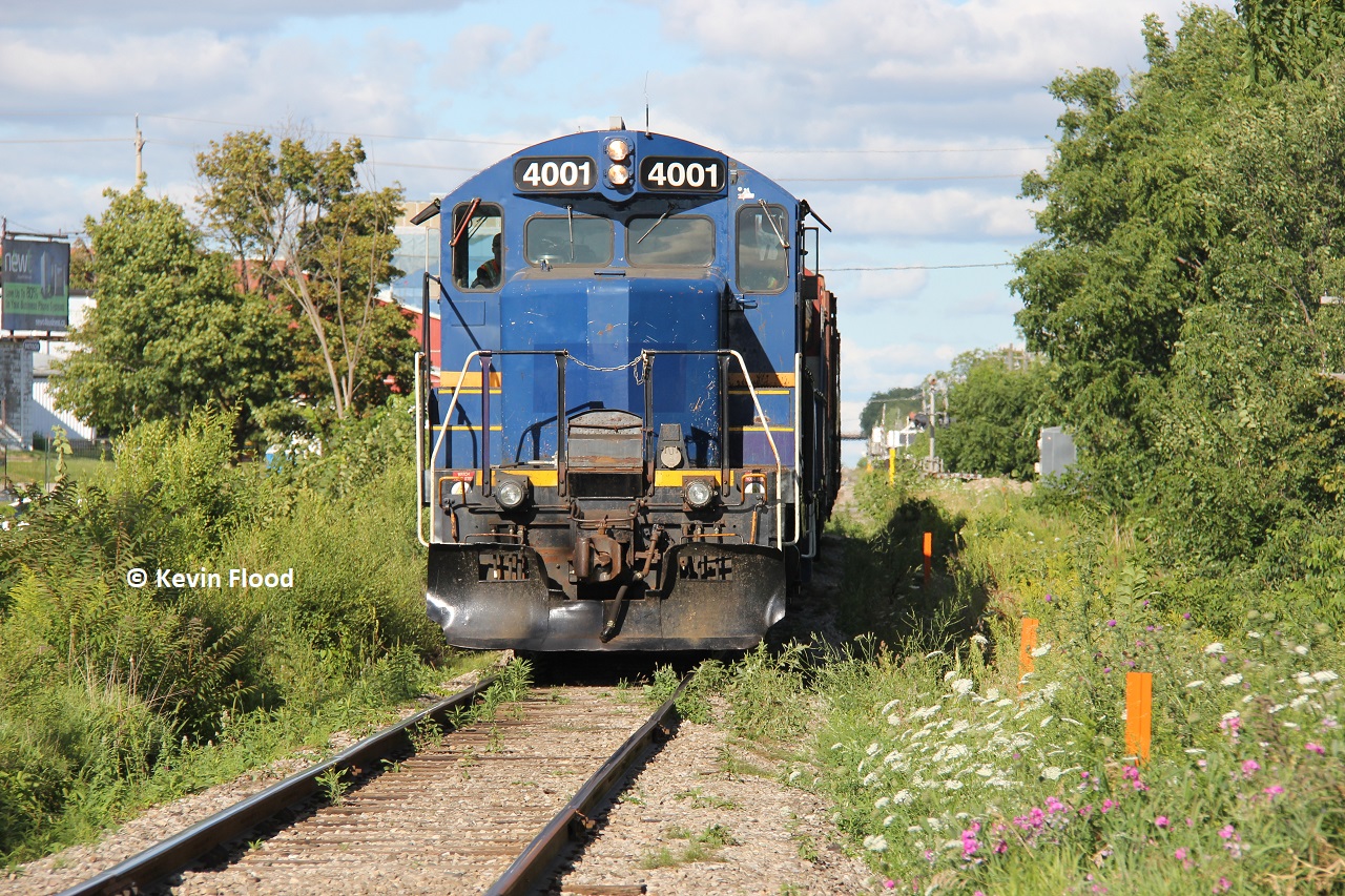 RLK 4001 approaches Strange St. with some other GEXR units behind in August, 2015 (no notes on the trailing power and can't tell from the angle; it does look like a red RLK unit though). The mainline almost looked like a spur line!