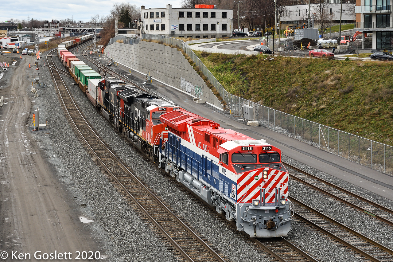 Montreal - Halifax intermodal train #120 at Turcot West led by CN's BC Rail heritage locomotive.