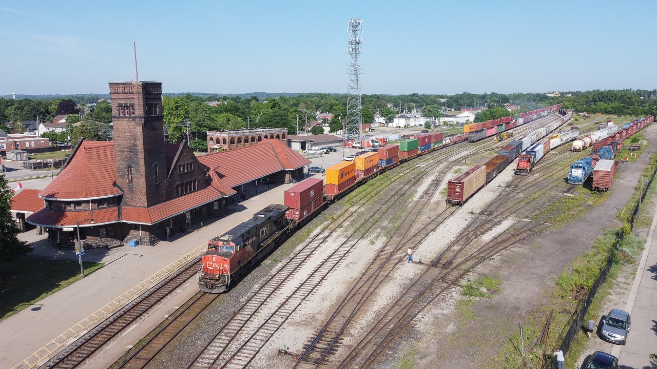CN 148 curves through Brantford on the North Track with CN 2241 leading the train.  During the summer CN ran a number of 148's with read DPU's resulting in trains such as this one.  Working the yard on this day was CN 1439 as the other CN power in the yard was out of fuel.