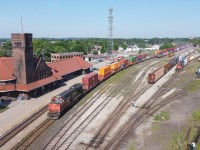 CN 148 curves through Brantford on the North Track with CN 2241 leading the train.  During the summer CN ran a number of 148's with read DPU's resulting in trains such as this one.  Working the yard on this day was CN 1439 as the other CN power in the yard was out of fuel.  