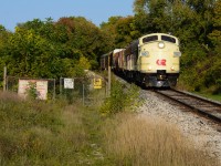 Just east of Downtown Ingersoll, the pair of former CN F units owned by the OSR roll into town with traffic from CP T69 in Woodstock. The CN noodle on the sign guarding the former site located beside the OSR/CN interchange which is out of frame provides a well composition in my eye with the history of these motors. With the F units having the most CN related history on OSR’s roster, I thought this shot would be the best fitting with these units on this very clear October evening - a great start to a good weekend. Was a good chase this day with good people and I’m pretty happy this shot is checked off for me. Anyone have info on the site that this gate was protecting? 
