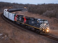 Grants Cut in Rivers Manitoba is a popular spot among train enthusiasts and non-train enthusiasts. The opportunity to shoot a BCOL C44-9W in that location was not being passed up. M312 Arrived in Rivers very early in the morning and was rounding the corner at the very first bit of light the sun was providing.