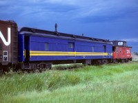 The tailend cars to the Muskeg Mixed. Not only were trains running off time but equipment was being stick handled around. Coach 5099 and an old NAR caboose, now CN caboose 79101, should have been a part of these cars. Instead, the coach and caboose went up earlier in the week and are still there, doing whatever. Tonight we get caboose 79508 and baggage 7857. In the near future, baggage 7857 will go into the shops to have extended windows installed so it can run as a tailend car with no need for a caboose (what I would term a bagboose in my notes LOL). Photo taken a couple of miles west of Redwater. Please see neighbouring post for part-1.