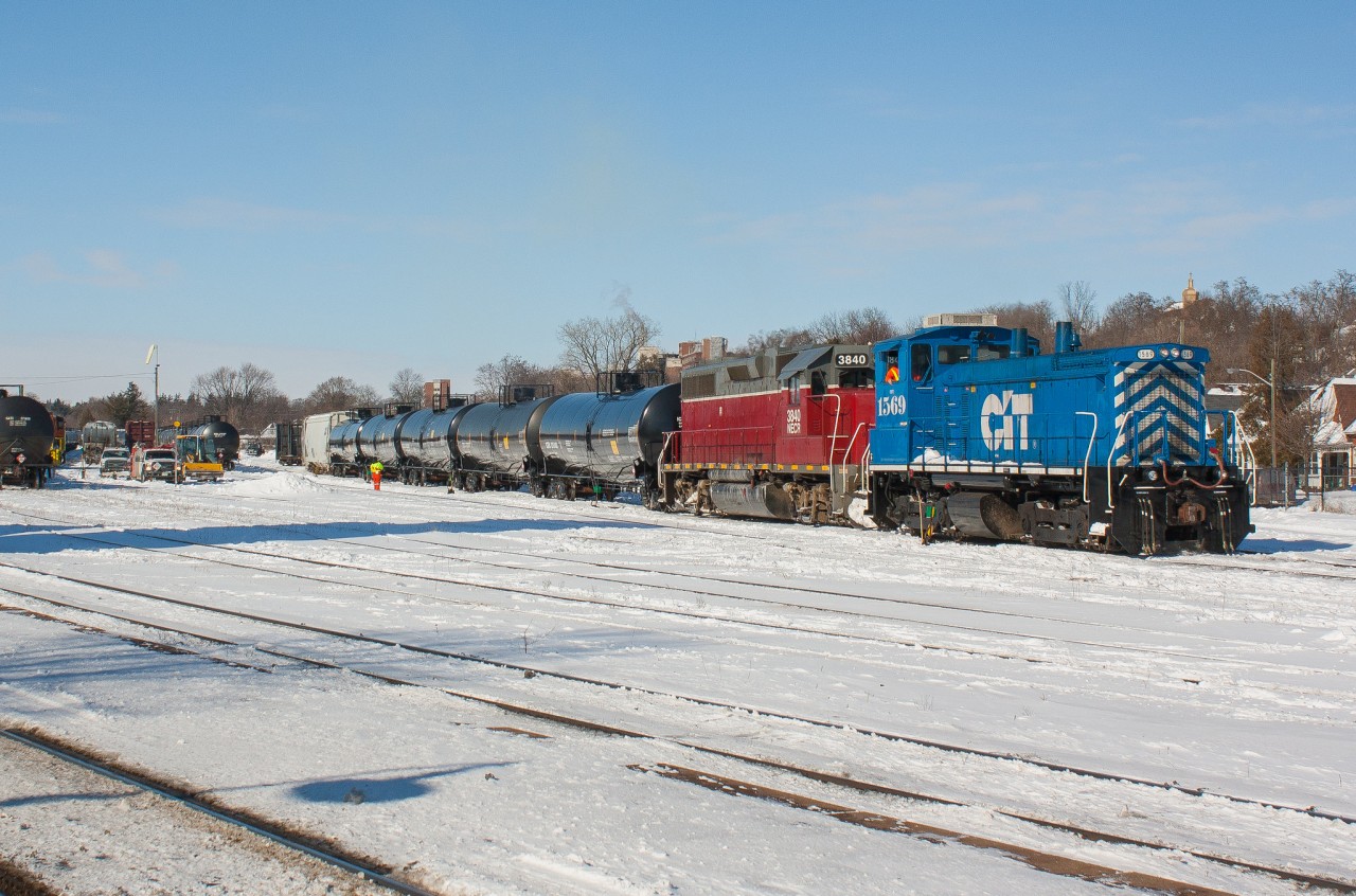 CEFX 1569 and NECR 3940 shuffle cars in the yard at Brantford on a bitterly cold February morning.  Both engines were in town to service the Burford Spur but would ultimately move around a bunch of cars for 597 that night before lifting the RLHH 3049 and heading back to Hamilton.  496 would return the next day to service Ingenia.