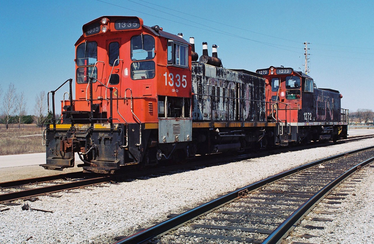 CN SW1200RS's 1335 and 1272 are seen stored and out of service at CN's MacMillan yard diesel shop in spring 1995. CN 1272 was possibly the last active SW1200RS in the original CN big noodle paint scheme. Both unit's would eventually be sold to Canac with 1335 later being sold to RaiLink. It would emerge as RLK 1201 and was assigned to RaiLink Southern Ontario where it would live on for several more years operating on assignments out of Brantford and Hamilton.